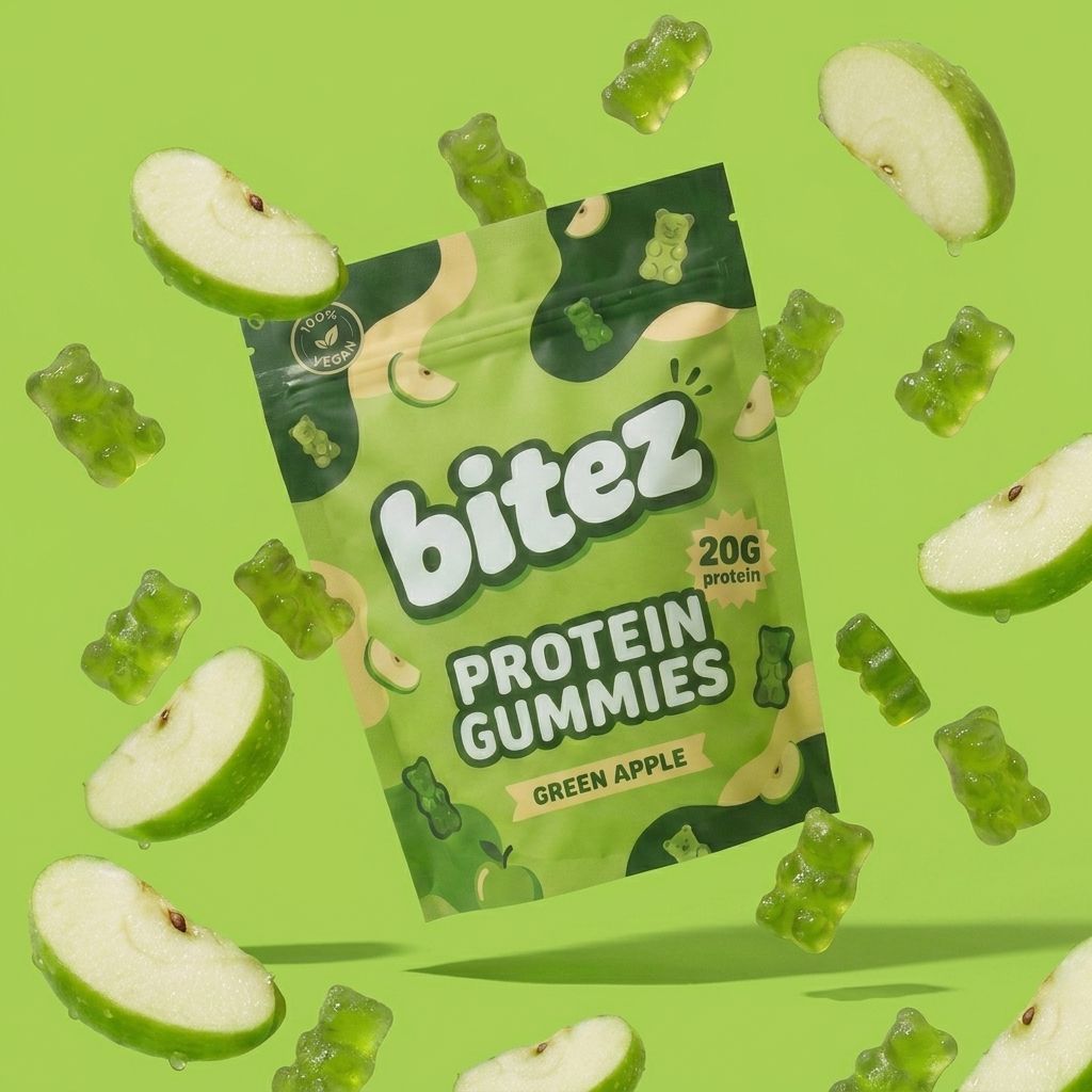 a bitez green apple protein gummies bag surrounded by flying gummy bears and fresh apple slices